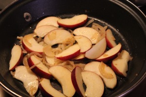 Add onions, then apples to skillet.