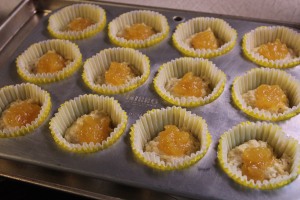 Place half the batter in muffins cups and add a teaspoon of lemon curd.